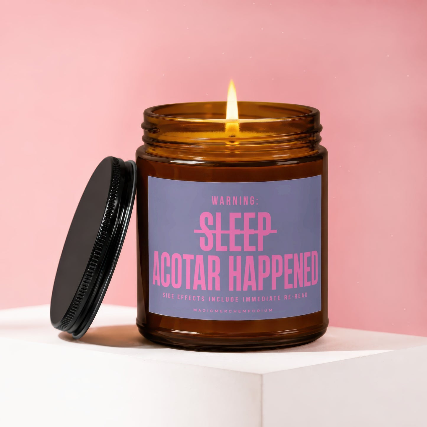 Amber candle with lit flame on pink background, showing "WARNING: SLEEP ACOTAR HAPPENED" text.