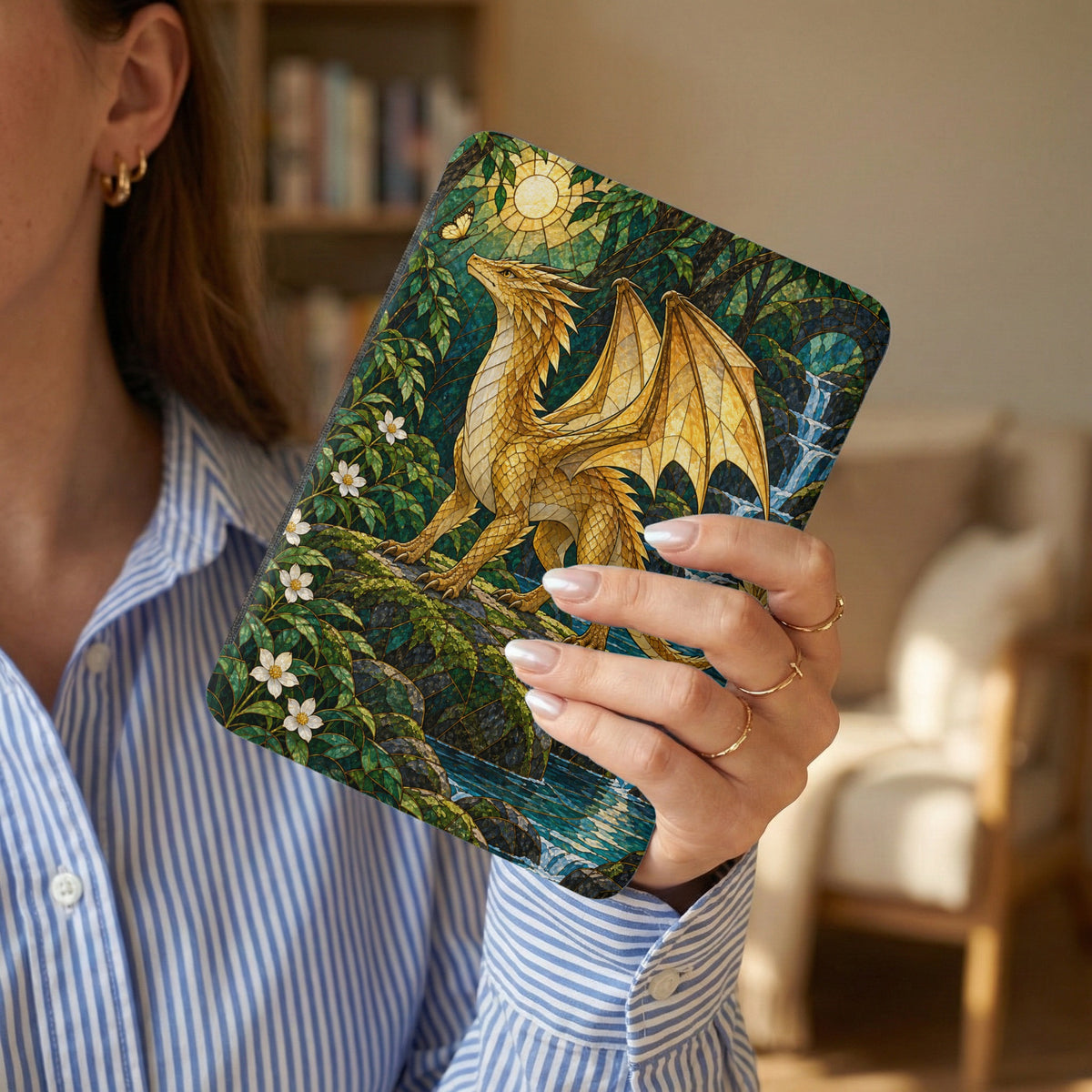 Golden dragon art on a cover with a waterfall and sun mosaic design.