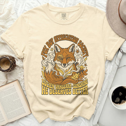 Cream t-shirt with a graphic of a fox and text "Fox Boy Appreciation Society" and "Lucien Vanserra Sunshine He Deserves Better."