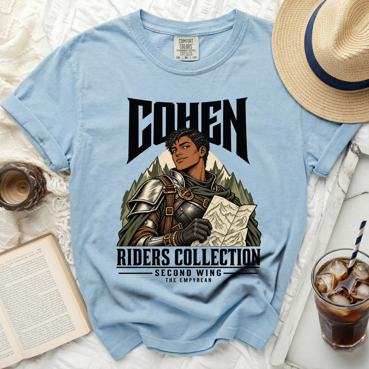 Light blue t-shirt with "COHEN RIDERS COLLECTION SECOND WING THE EMPYREAN" graphic.