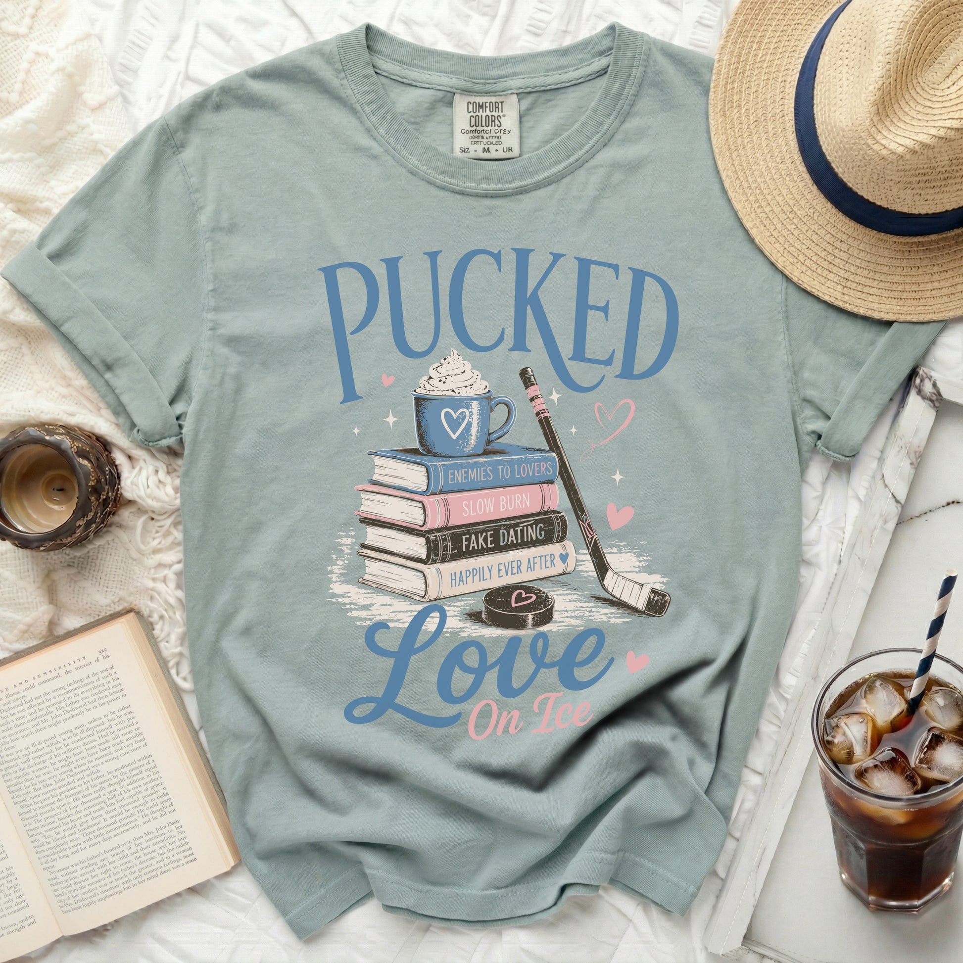 Light blue t-shirt with "Pucked Love On Ice" hockey-themed graphic.