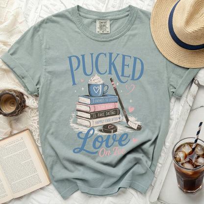 Light blue t-shirt with "Pucked Love On Ice" hockey-themed graphic.