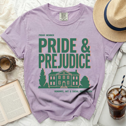 Purple t-shirt with "Pride & Prejudice" text and house graphic.