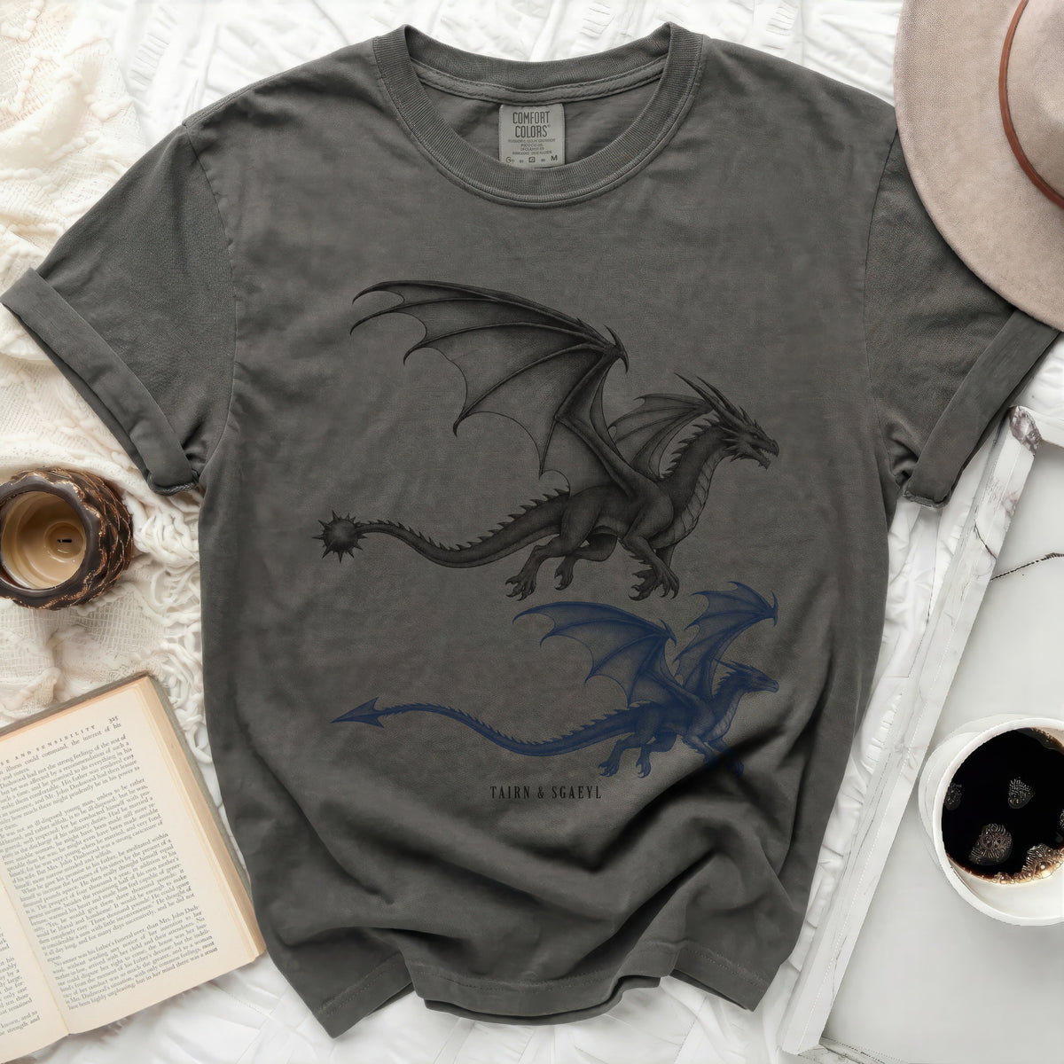 Dark grey t-shirt with two dragon designs and text "TAIRN & SGAEYL".