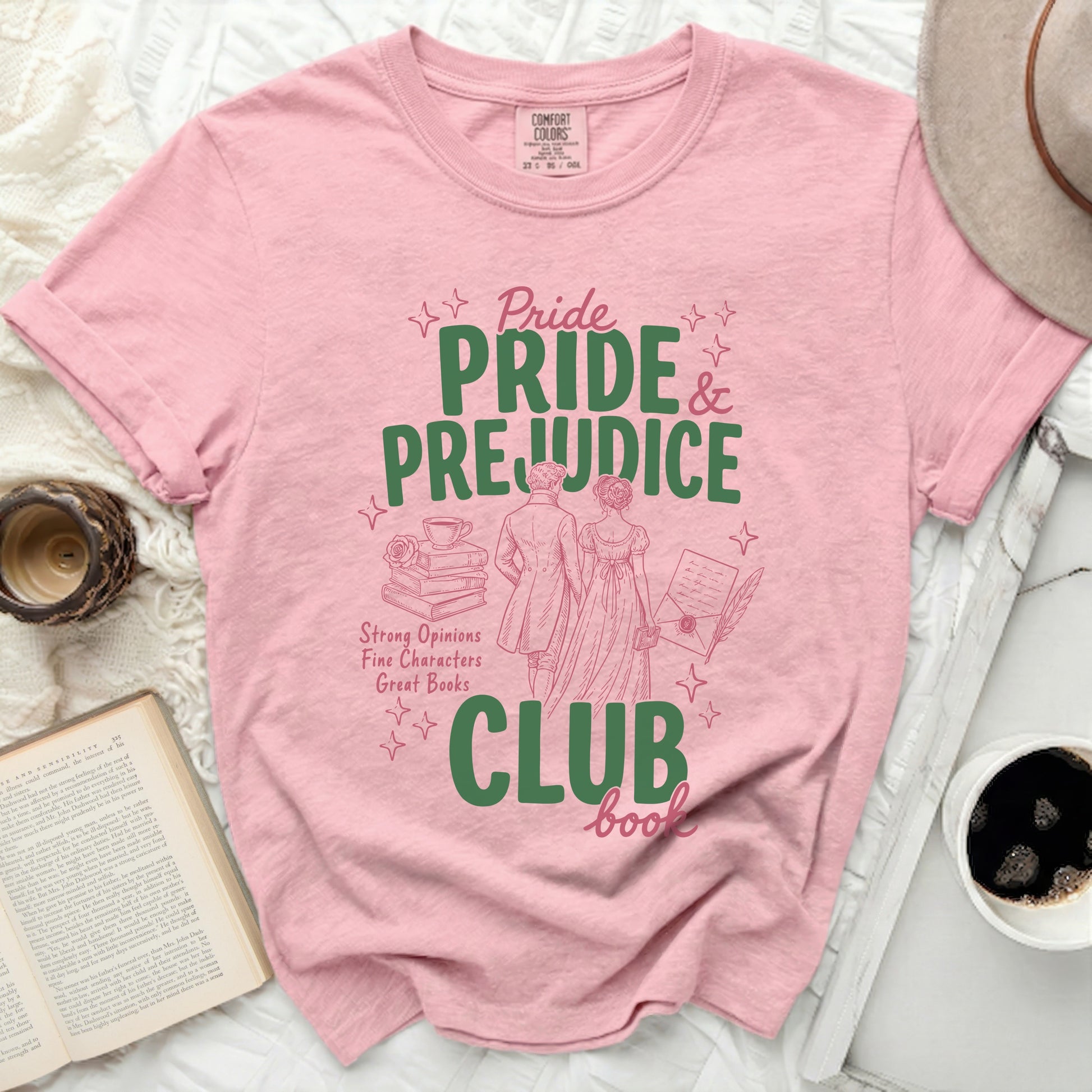 Pink t-shirt with "Pride and Prejudice Club" and vintage illustration.