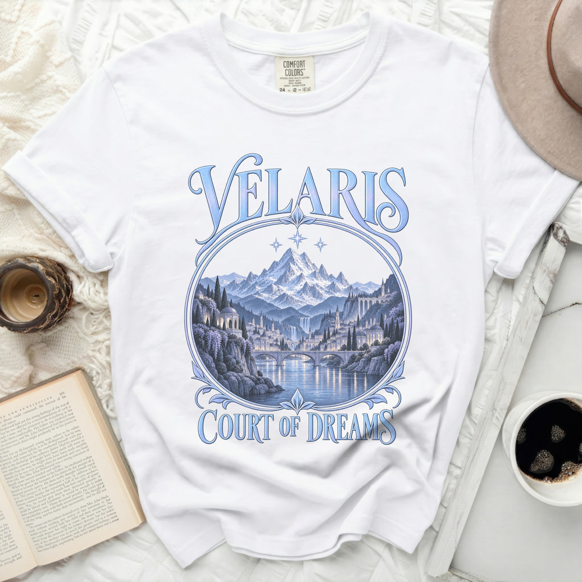 White t-shirt with "Velaris Court of Dreams" text and a fantasy city landscape.