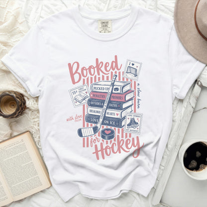 "Booked for Hockey" graphic tee with books and hockey imagery.