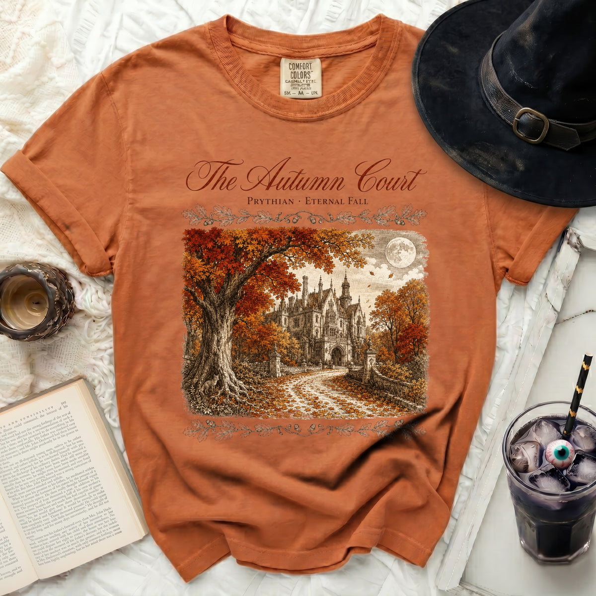 Orange t-shirt with "The Autumn Court" and castle graphic.