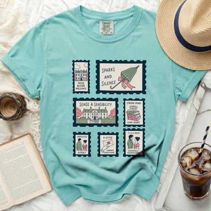 Teal comfort colors shirt with postage stamp graphics of book titles.