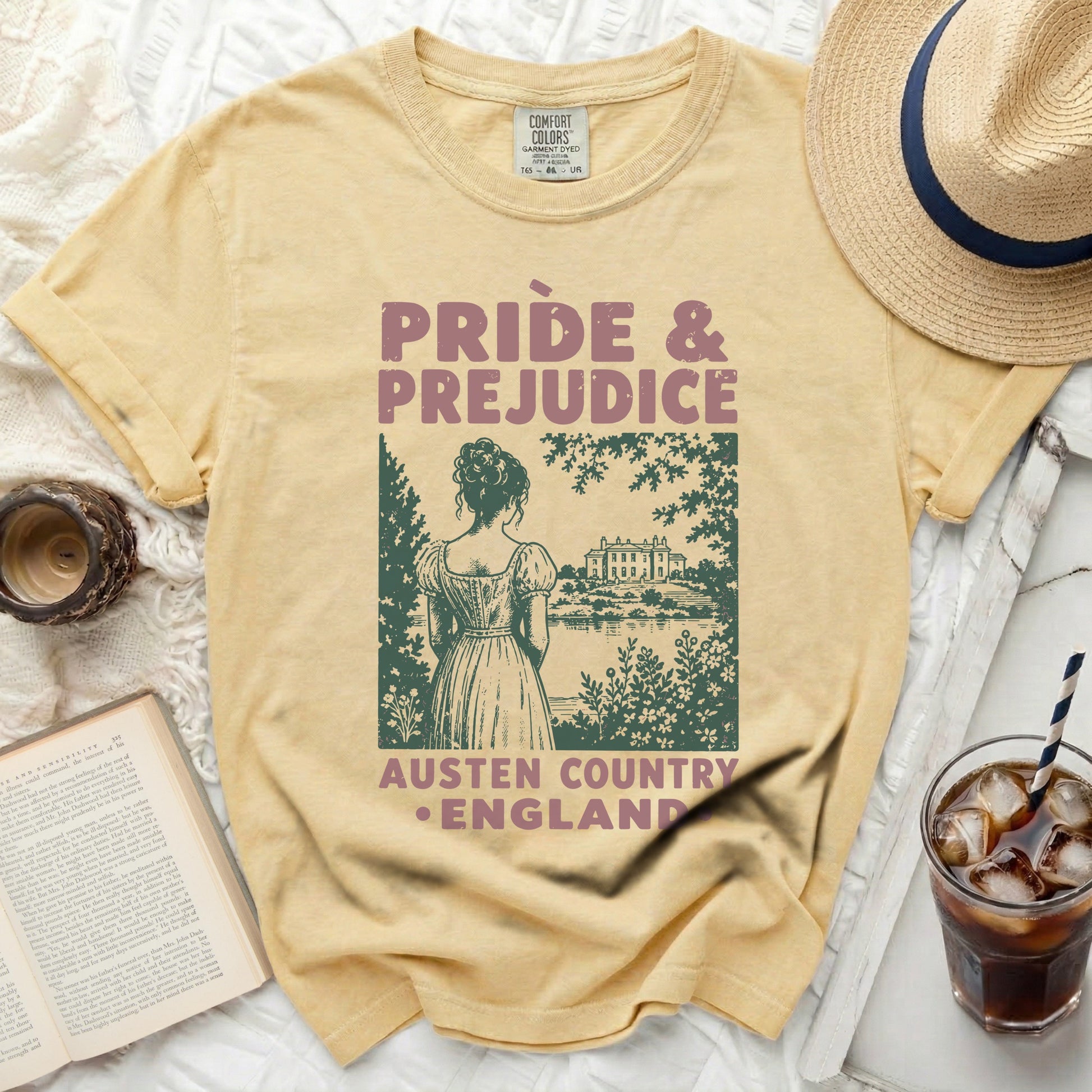 "Pride & Prejudice" t-shirt with a scenic illustration and text.