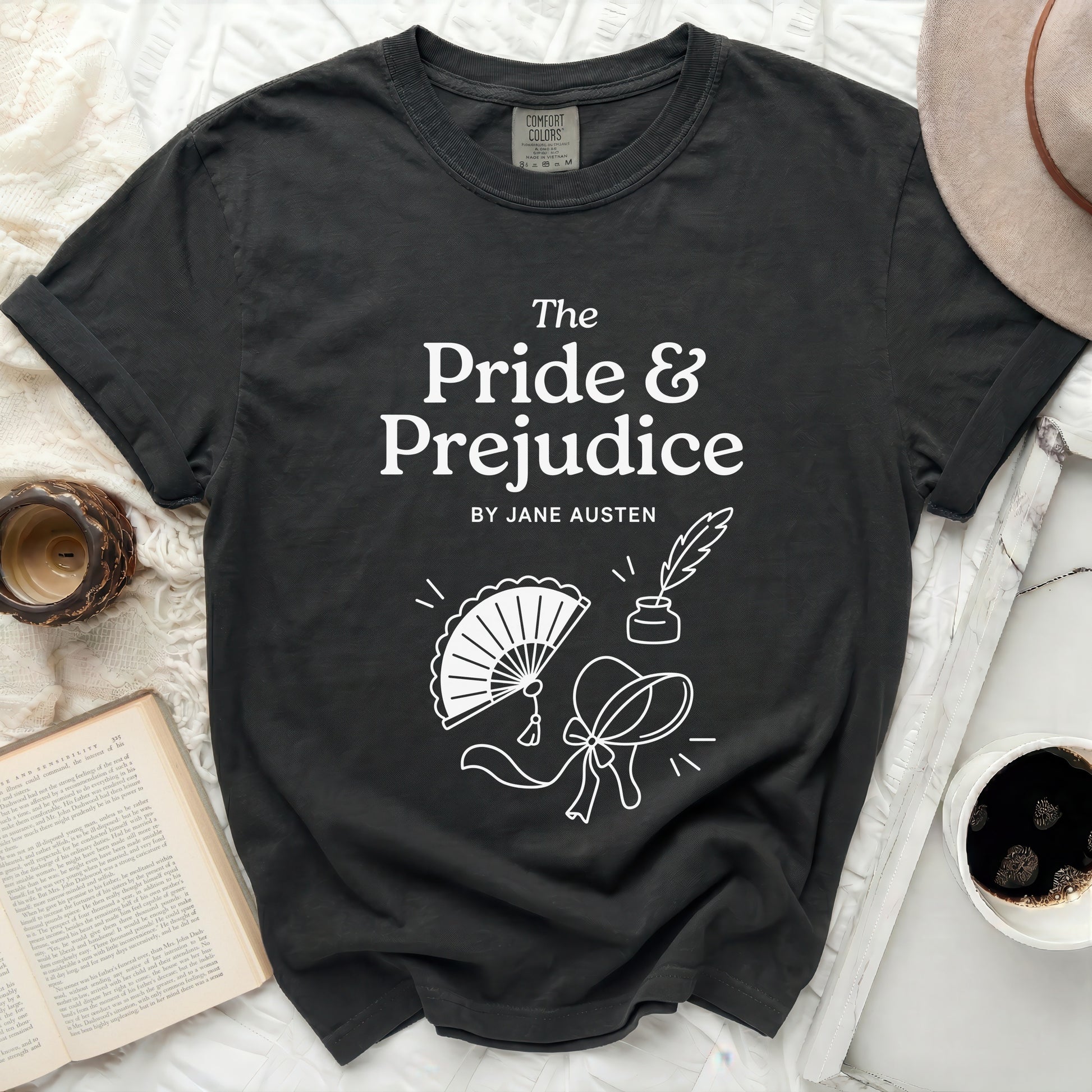 Dark grey t-shirt with "The Pride & Prejudice by Jane Austen" and line drawings.