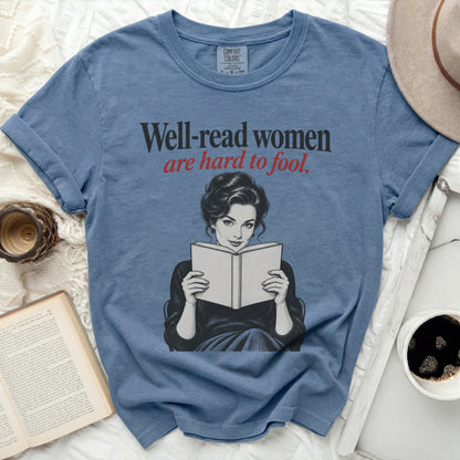 Blue t-shirt with "Well-read women are hard to fool" text and woman reading.