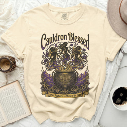 Cream t-shirt with "Cauldron Blessed Nesta Archeon - Made in the Dark" graphic.
