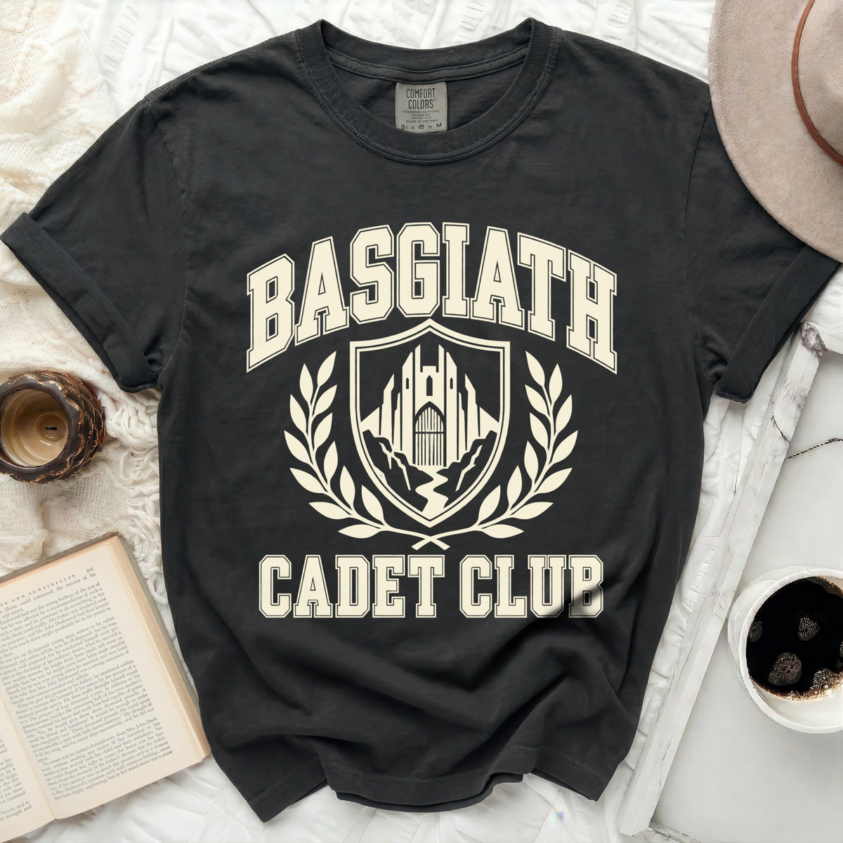 Black t-shirt with "Basgiath Cadet Club" text and crest graphic.