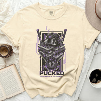 Cream t-shirt with hockey helmet, puck, and books graphic.