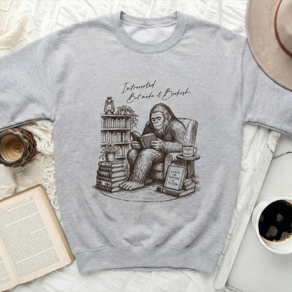 Crew neck sweatshirt with a sketch of Bigfoot reading books and a "Bookish" quote.