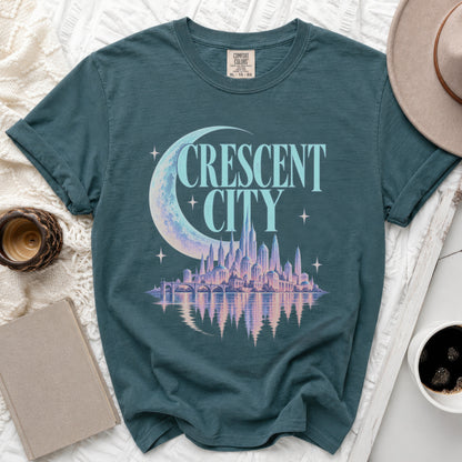 Teal t-shirt with "Crescent City" text and a city skyline graphic.
