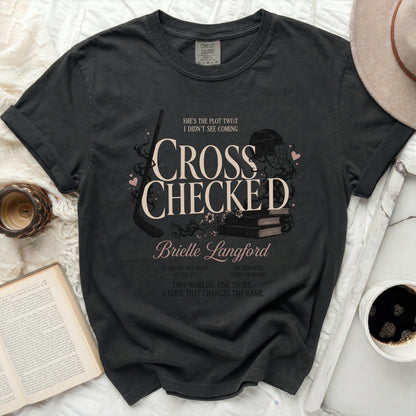Dark t-shirt with "Cross Checked" by Brielle Langford book cover design.