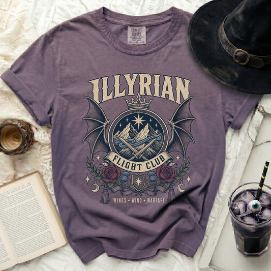 Purple t-shirt with "Illyrian Flight Club" design featuring wings, mountains, swords, roses, and text.