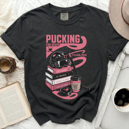 Black t-shirt with "Pucking for Keeps" text, hockey theme, and book titles.