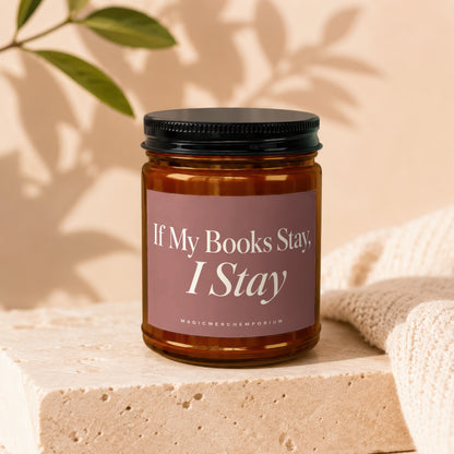 Amber jar candle with pink label reading "If My Books Stay, I Stay".