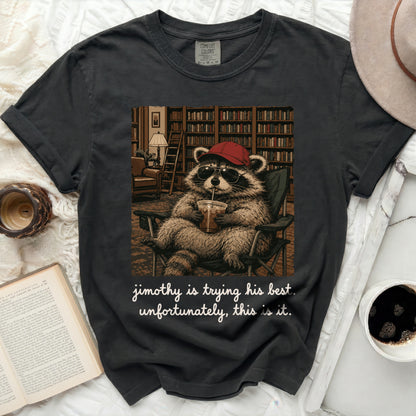 Black t-shirt with a raccoon wearing sunglasses and a hat, holding a drink.