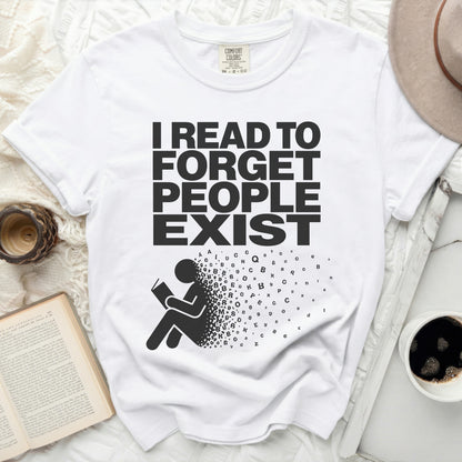 White t-shirt with "I READ TO FORGET PEOPLE EXIST" text and person reading.