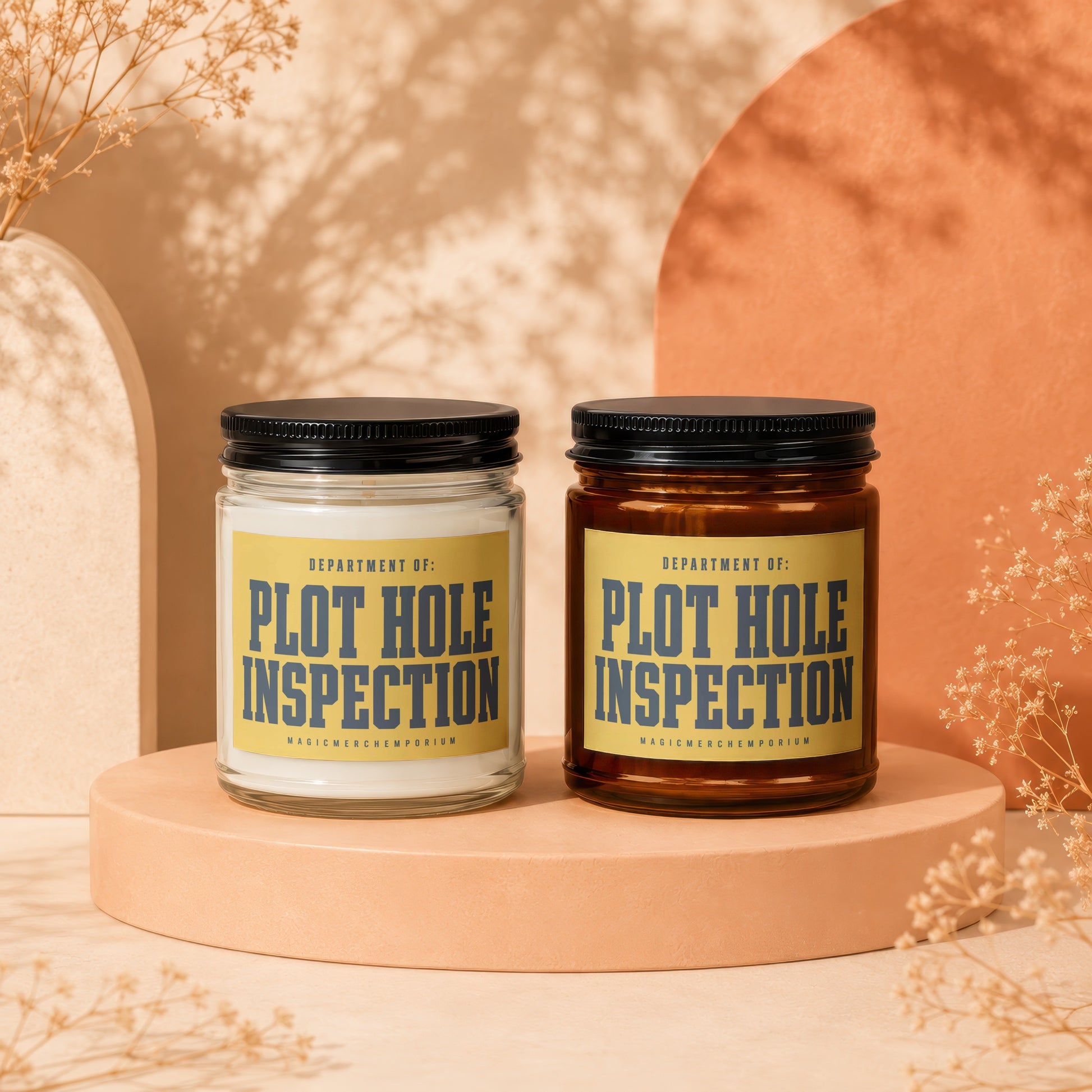 Two candles labeled "Plot Hole Inspection" by MagicMerchEmporium, one clear glass and one amber.