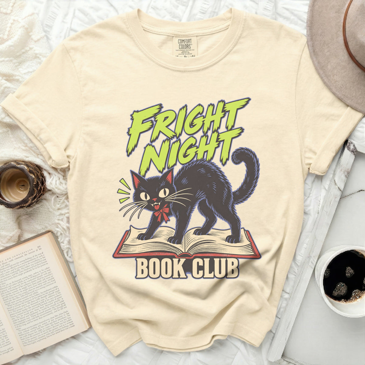 Black cat on an open book with "Fright Night Book Club" text.
