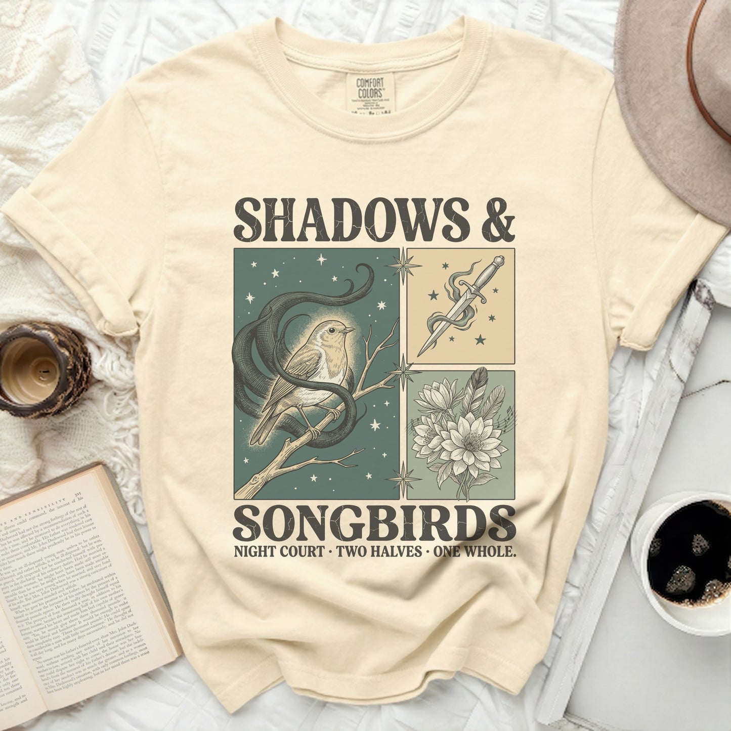Cream Comfort Colors t-shirt with "SHADOWS & SONGBIRDS" and illustrated bird, snake, dagger, and flowers.