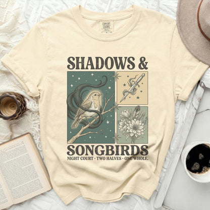Cream Comfort Colors t-shirt with "SHADOWS & SONGBIRDS" and illustrated bird, snake, dagger, and flowers.