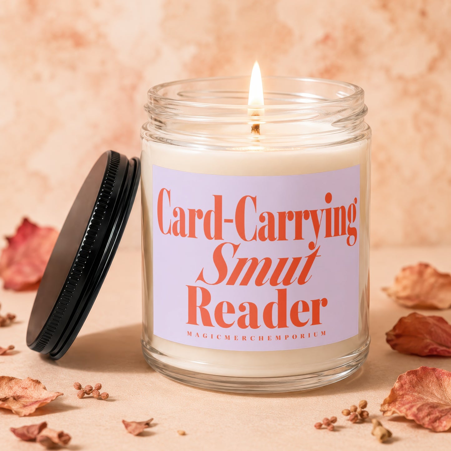 Candle with "Card-Carrying Smut Reader" text and a lit wick.