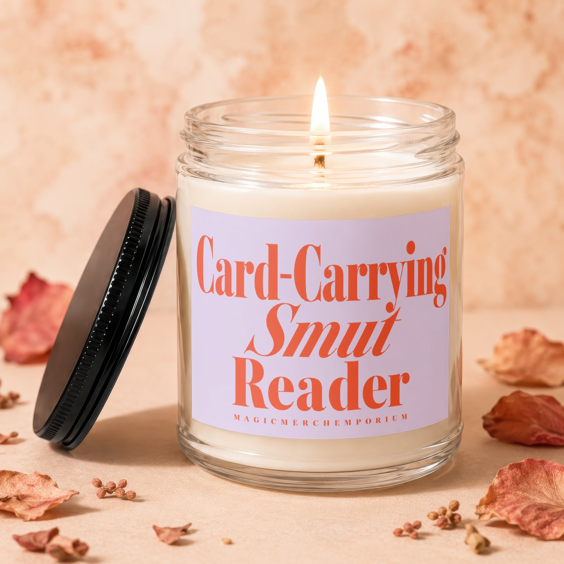 Candle with "Card-Carrying Smut Reader" text and a lit wick.
