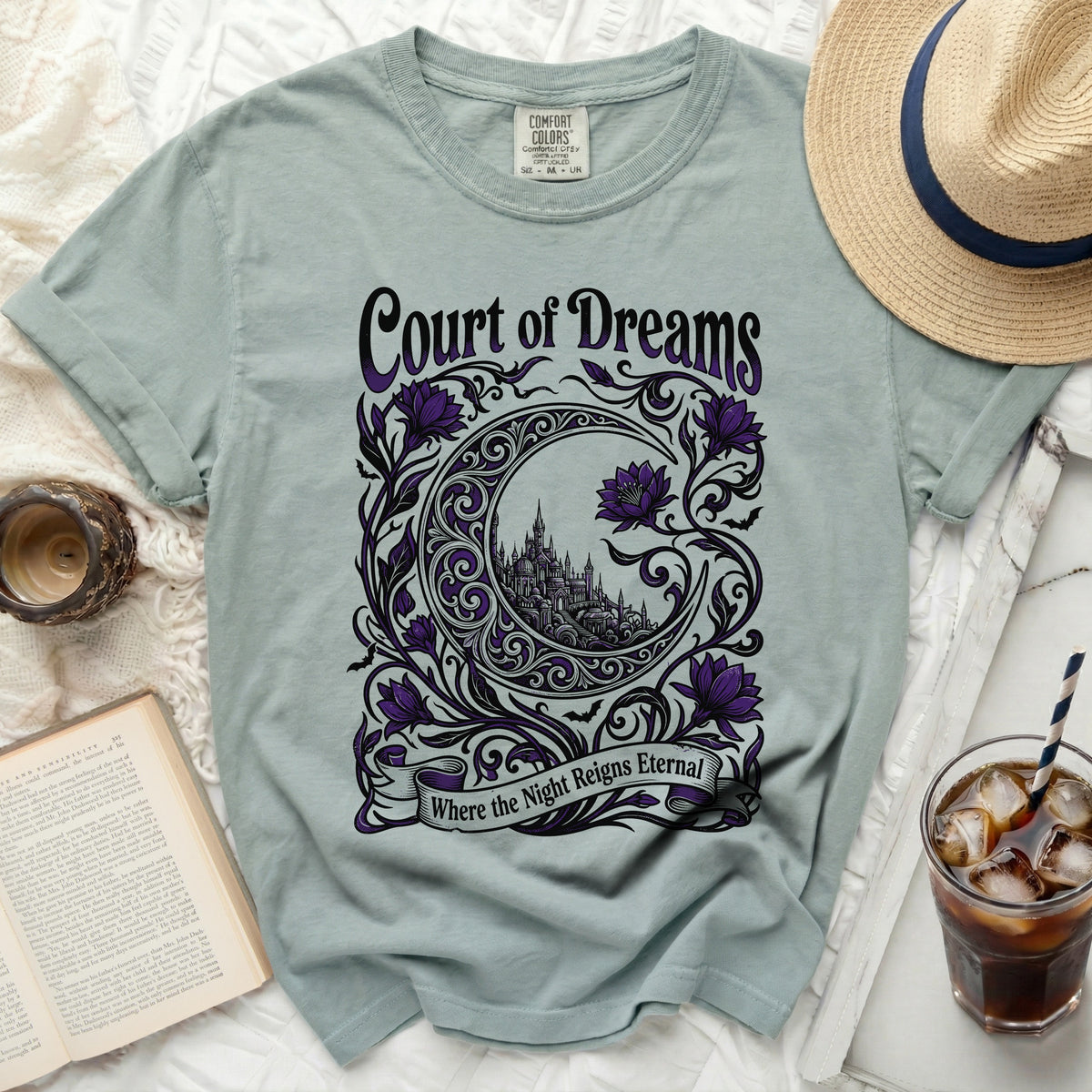 T-shirt with "Court of Dreams" text, crescent moon, castle, and purple flowers.