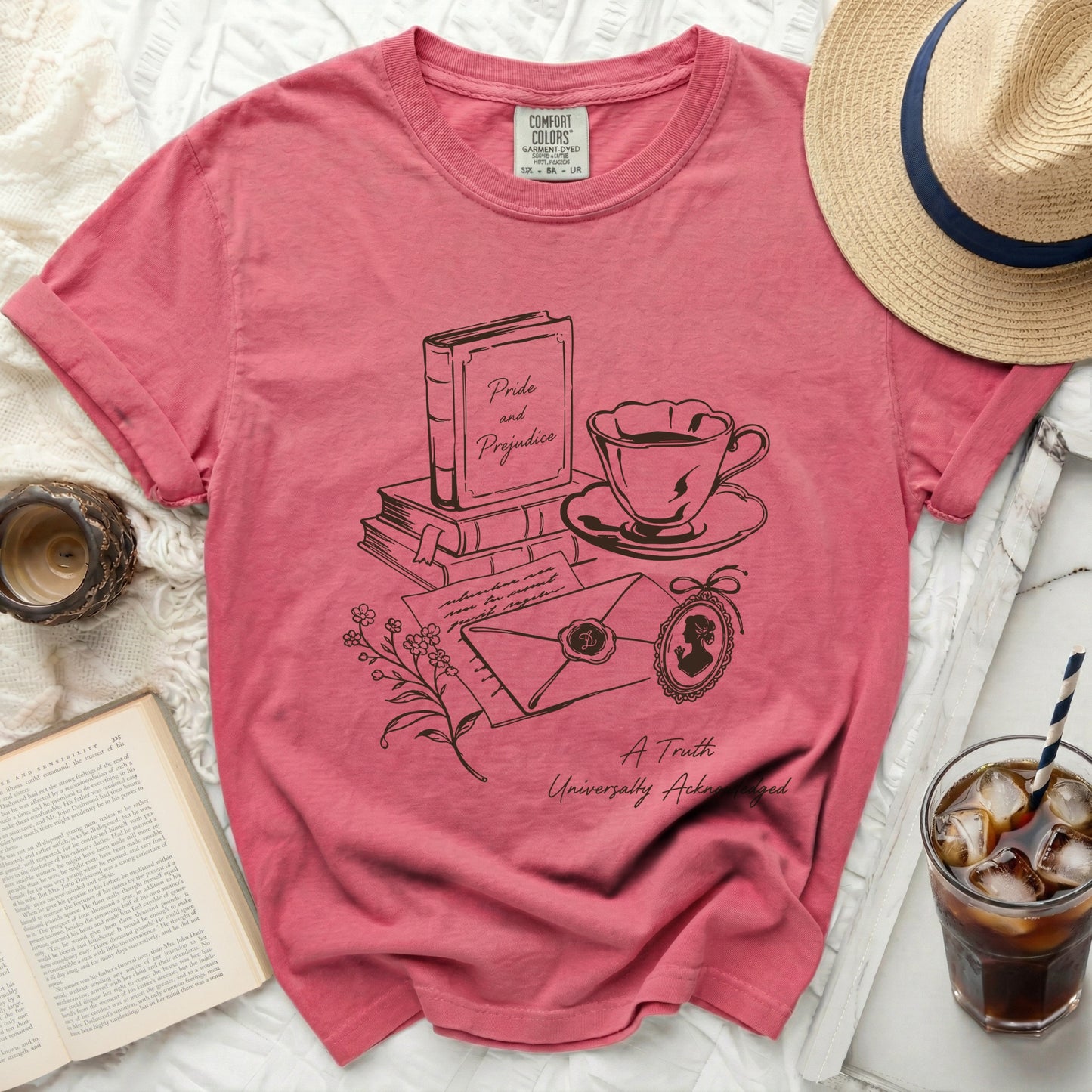 Pink t-shirt with "Pride and Prejudice" literary sketch and quote.