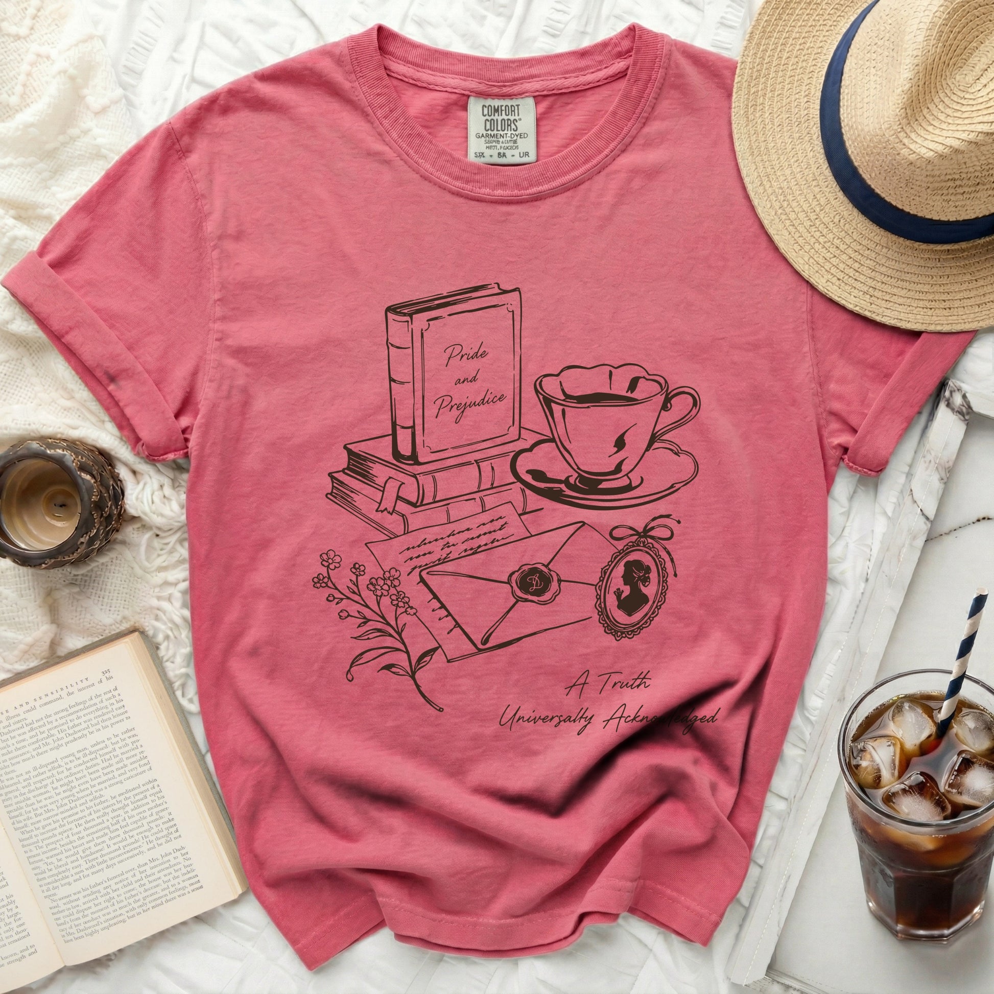 Pink t-shirt with "Pride and Prejudice" literary sketch and quote.