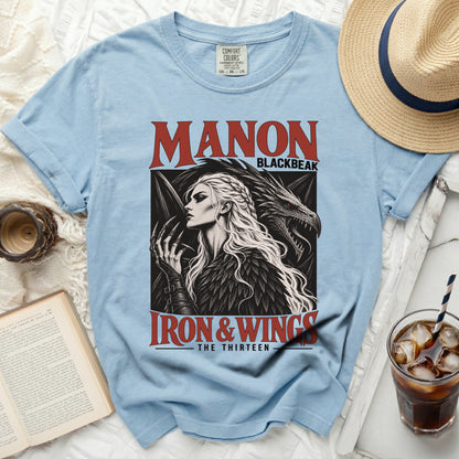 Light blue t-shirt with "Manon Blackbeak Iron & Wings The Thirteen" graphic.