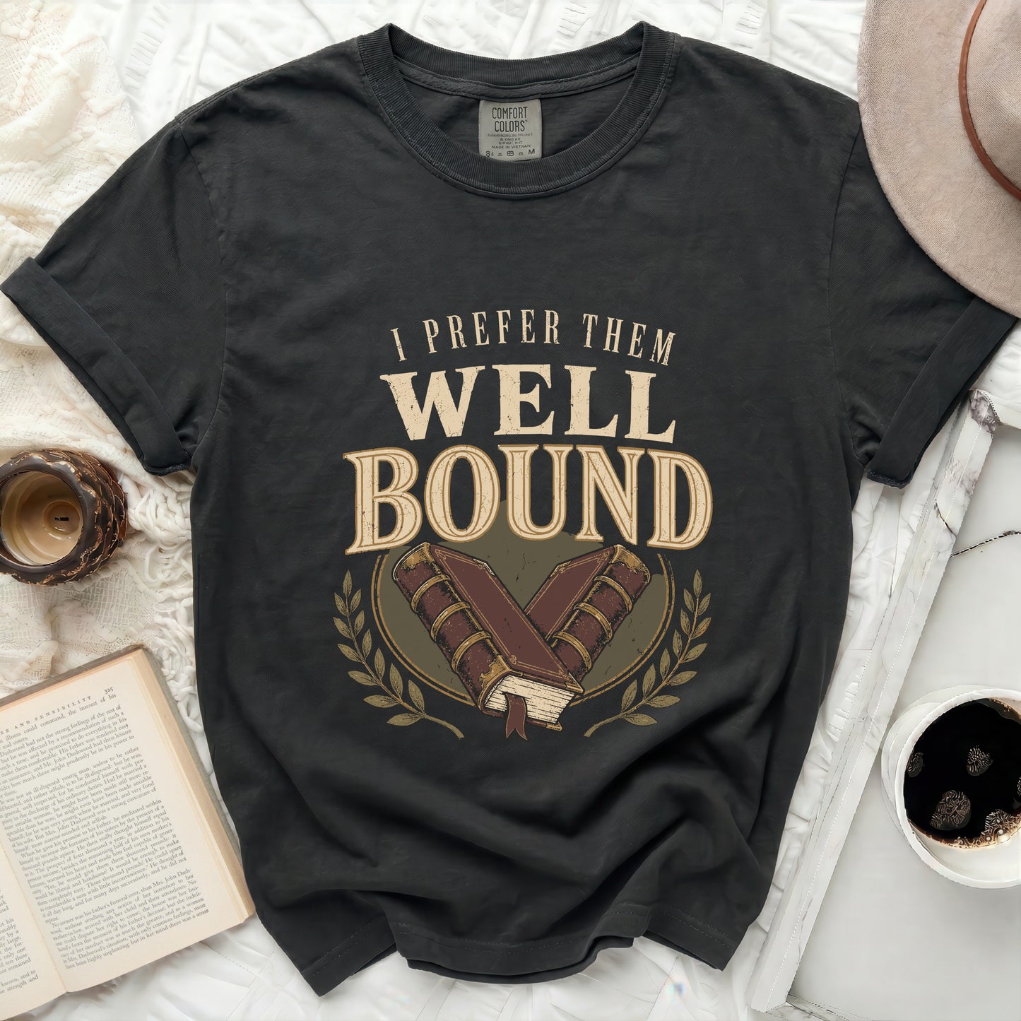 Dark t-shirt with "I prefer them well bound" and book graphic.