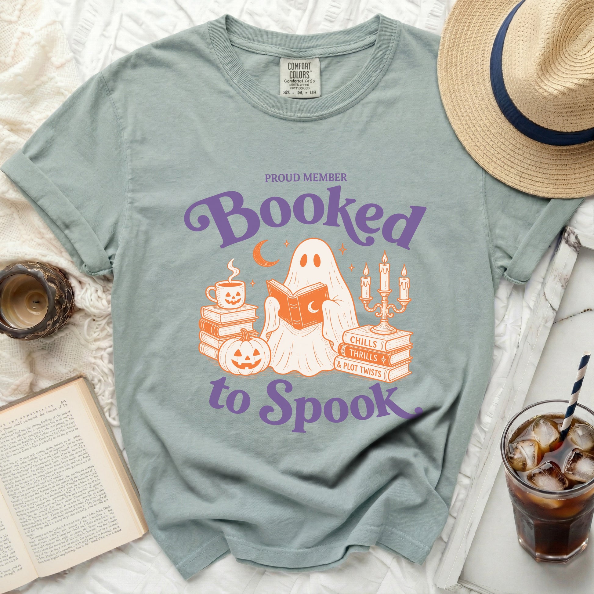 Ghost reading on books with "Booked to Spook" text.