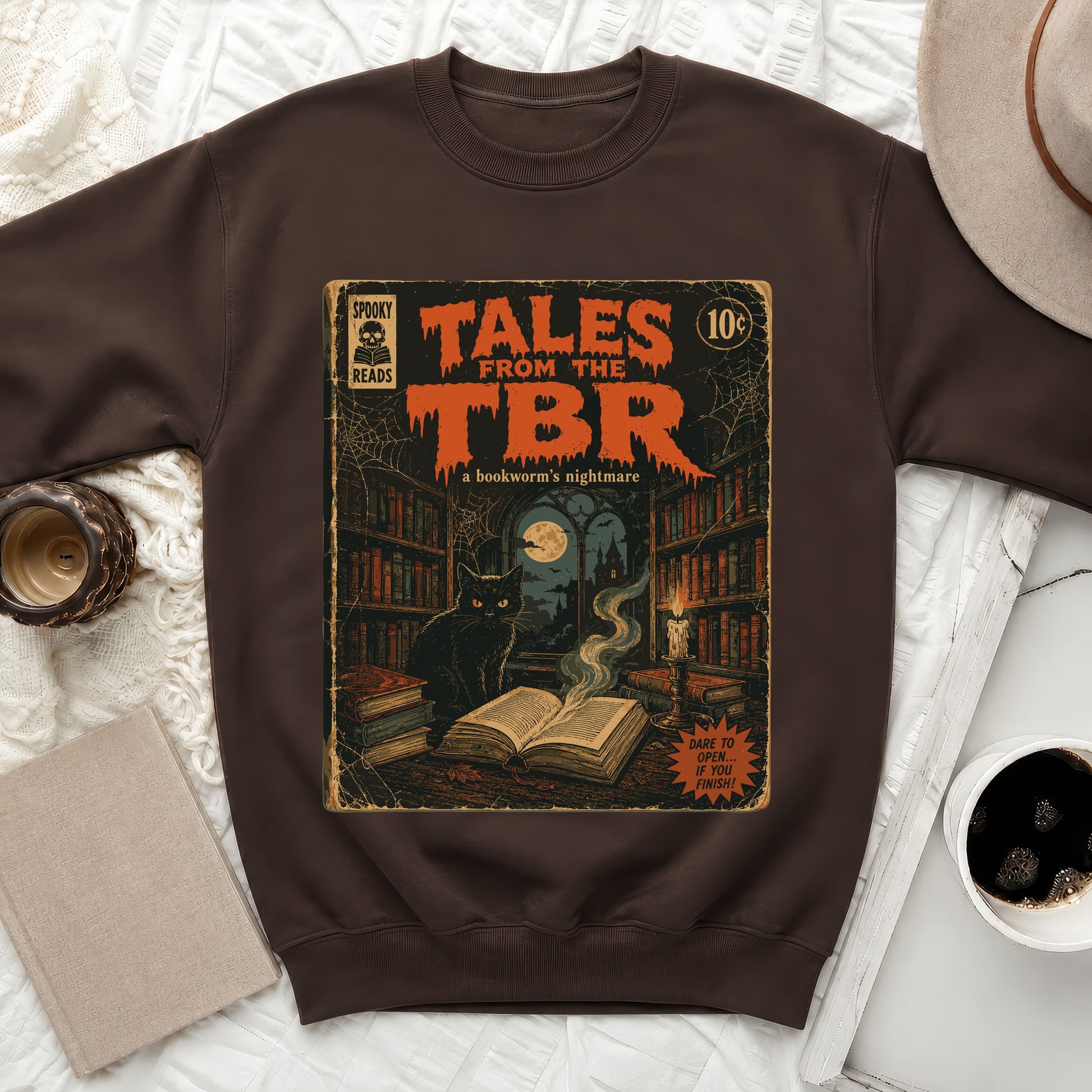 Dark brown sweatshirt with "Tales From The TBR" comic art.