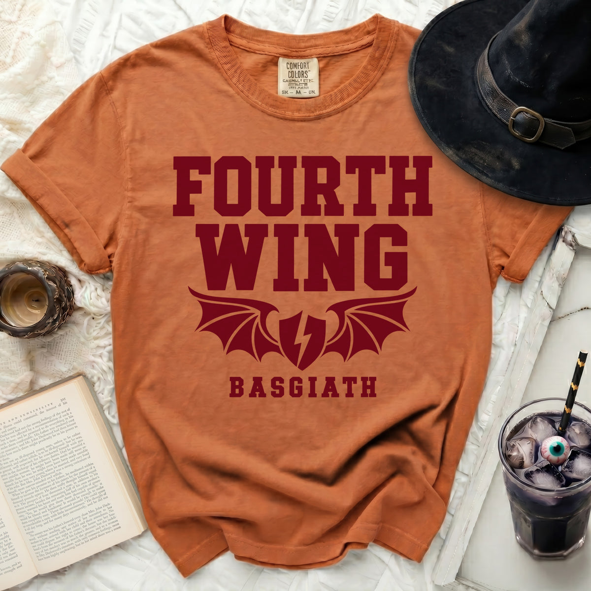 Orange t-shirt with "Fourth Wing Basgiath" and dragon wings graphic.