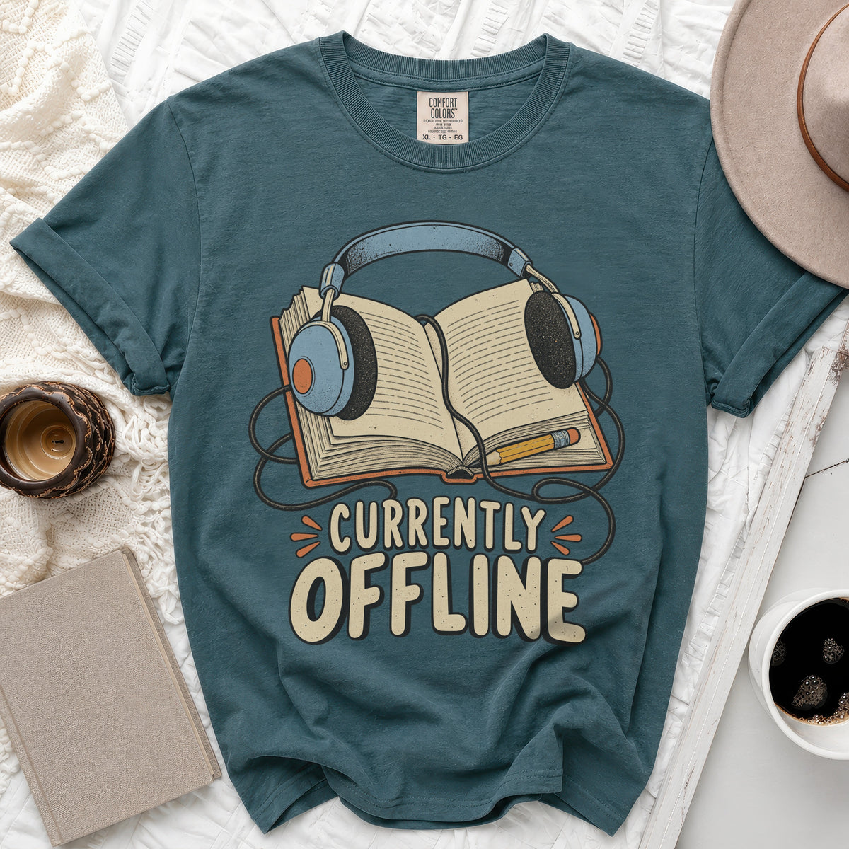 Teal t-shirt with "Currently Offline" text, headphones, and open book graphic.