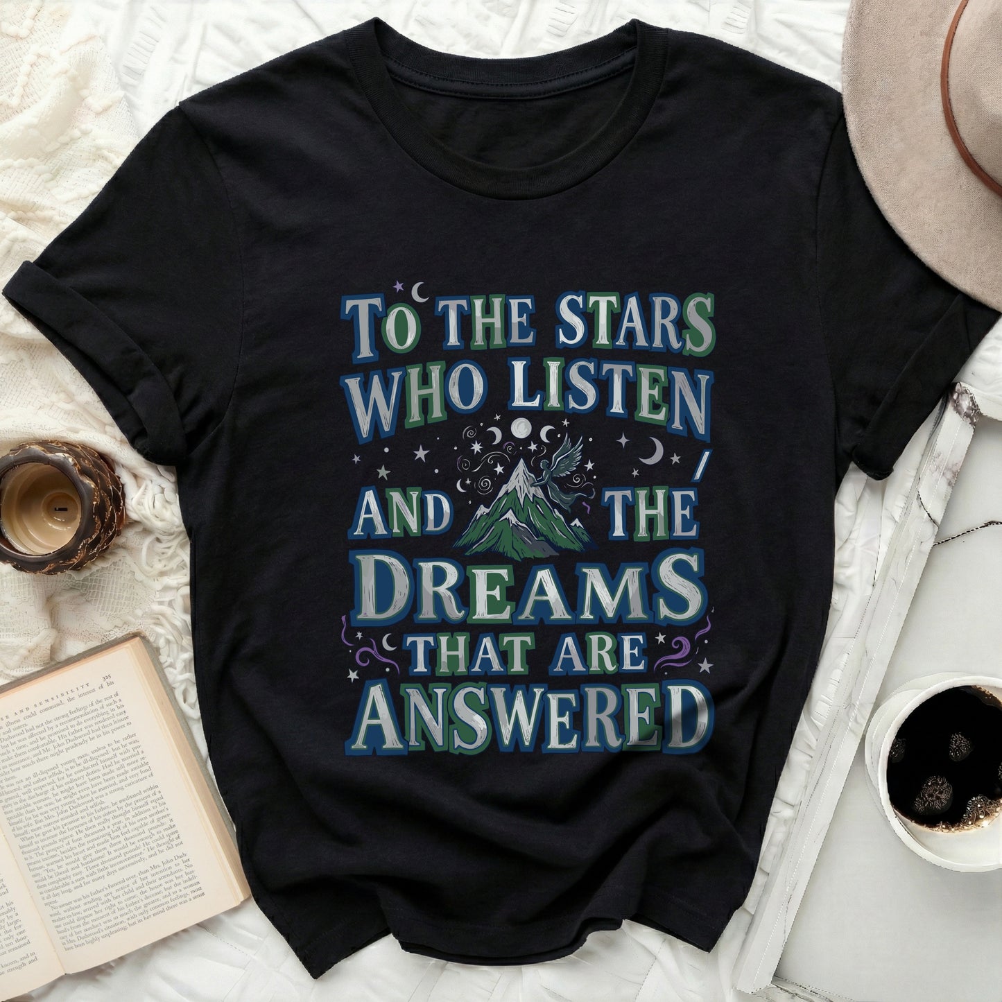 TO THE STARS WHO LISTEN AND THE DREAMS THAT ARE ANSWERED product type
Black T-Shirt, Stars Who Listen, Dreams Answered, Celestial Design, Fantasy T-Shirt, Mountain Graphic, Winged Creature, Mystical Tee, Inspirational Quote, Night Sky Theme, Unique Shirt, Graphic Tee, Moon Stars Print, Literary Inspired, Spiritual Gift, Dark Aesthetic, Unisex T-Shirt, Casual Wear, Trendy Apparel, Magical Design