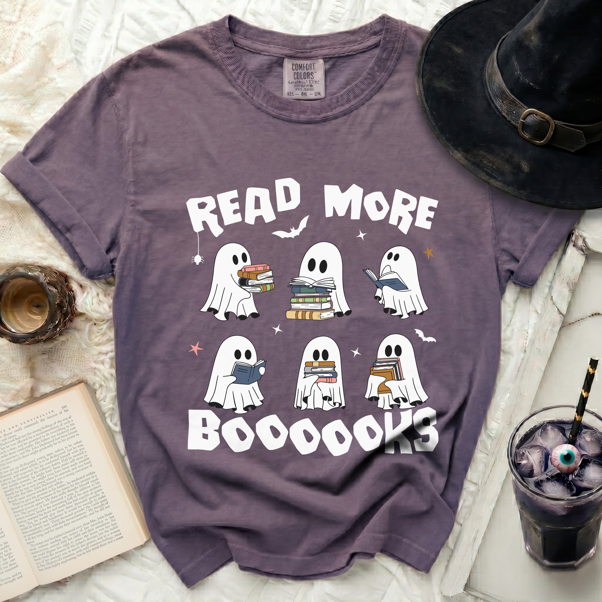 Purple t-shirt with ghosts reading books and "Read More Boooooks" text.