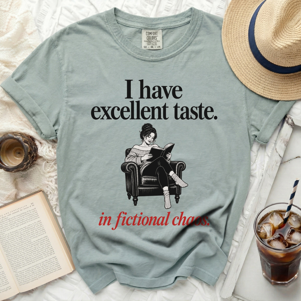 "I have excellent taste. in fictional chaos." graphic t-shirt with seated reader.
