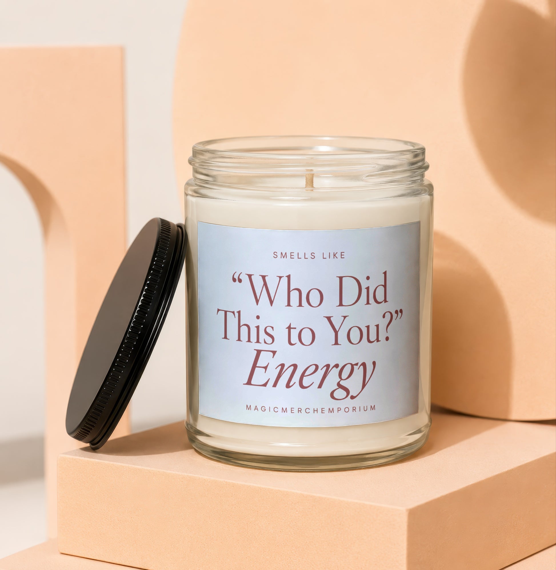 Candle labeled "Who Did This to You?" Energy.