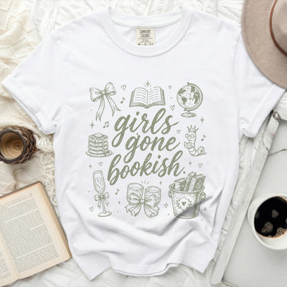 White t-shirt with "girls gone bookish" graphic featuring books, globe, and hearts.