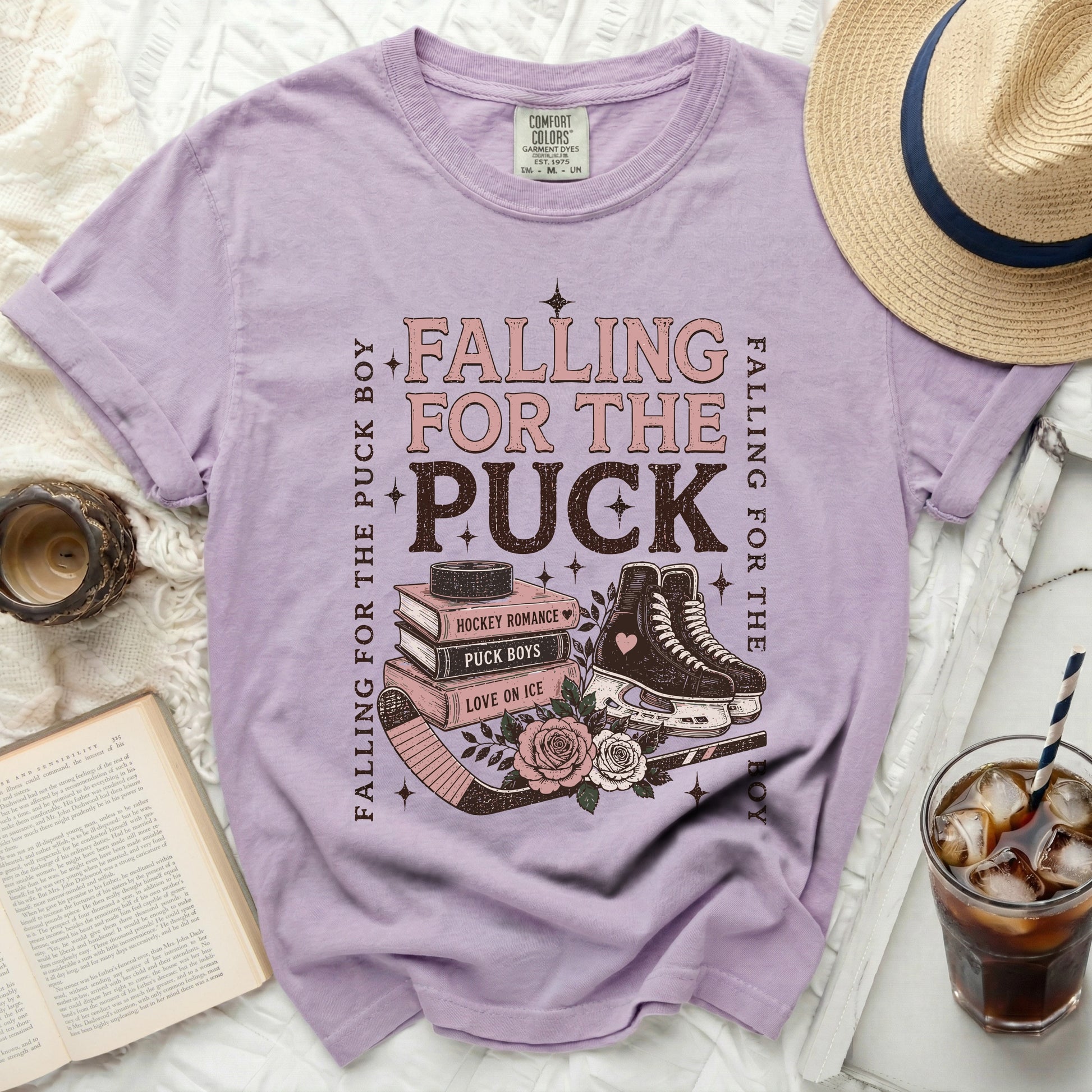 Purple t-shirt with "Falling for the Puck Boy" and hockey graphic.