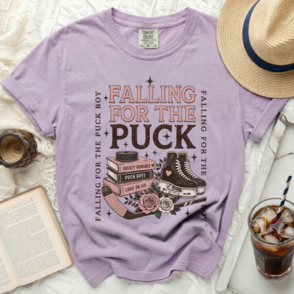 Purple t-shirt with "Falling for the Puck Boy" and hockey graphic.