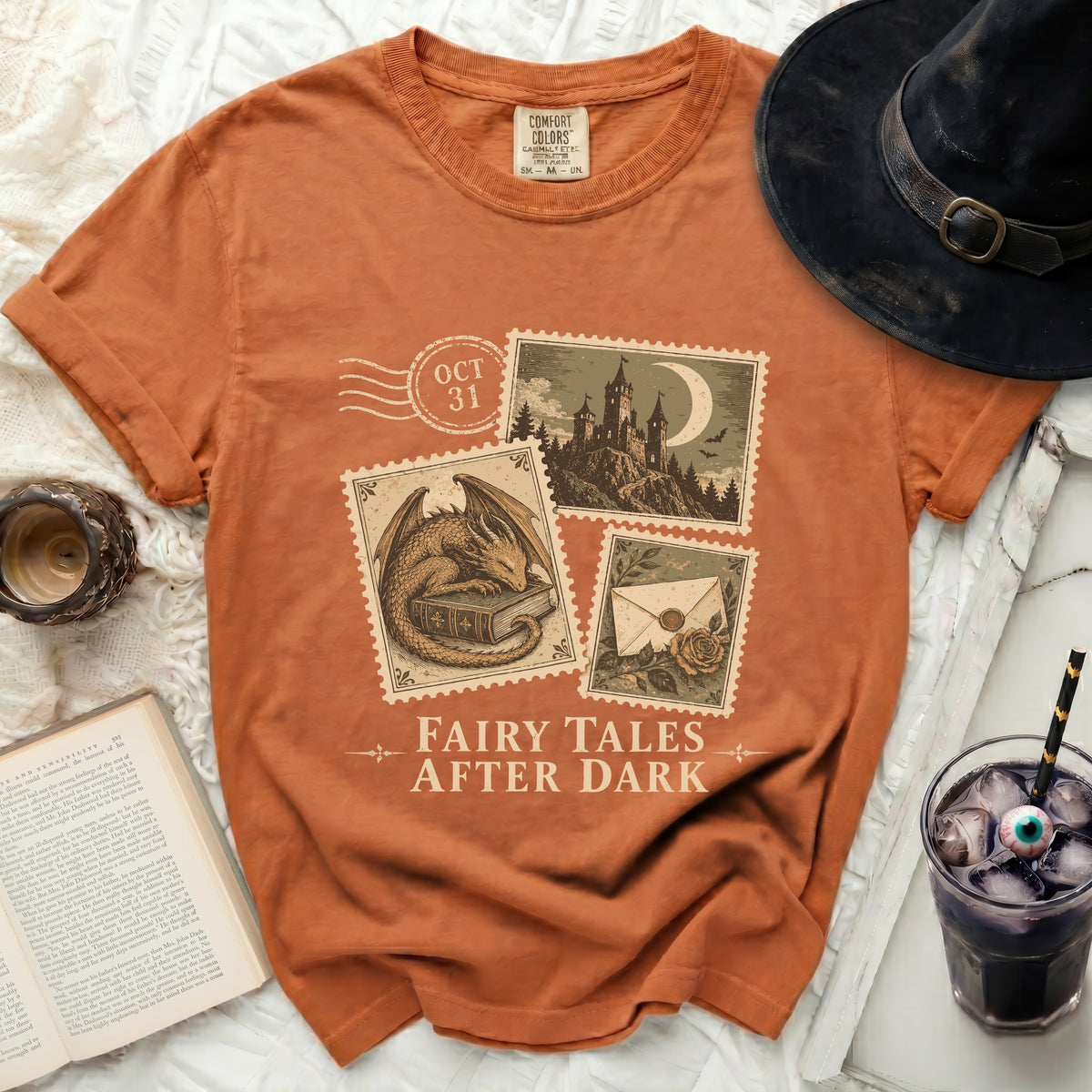 Orange t-shirt with "Fairy Tales After Dark" and Halloween postage stamp graphics.